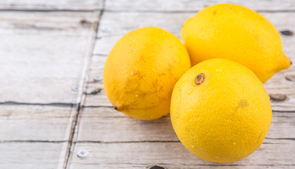 Lemon fruit over rustic wooden background
