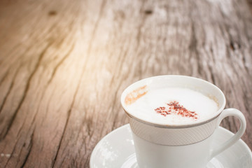 Cappuccino milk coffee on wood table