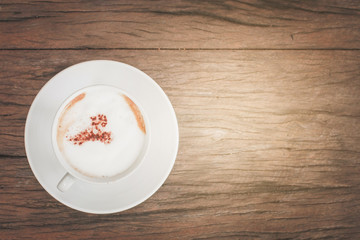Cappuccino milk coffee on wood table