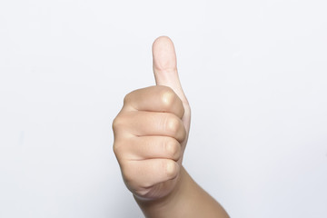 Boy raising one fingers up on hand that is thumb up its shows superb or excellent symbol on white background.
