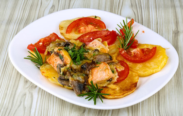 Roasted salmon with potato and tomato