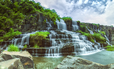 Pongour on summer days with many storied stone structure water flowing in the great stone steps. First waterfall in Lam Dong is here