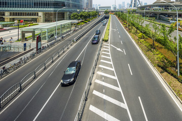 cityscape of shanghai and traffic on road