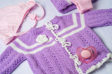 Warm knitted sweater for a baby, close-up