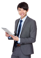 Young businessman use of the tablet pc