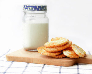 Fototapeta na wymiar Breakfast set, glass of milk, snack on wooden plate