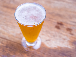 Closeup beer on vintage wood background