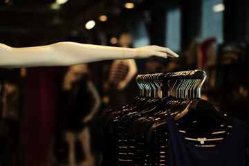 Hand of mannequin and clothes on hanger