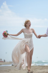 Fototapeta na wymiar Happy smiling bride on beach