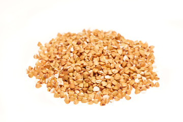 Pile of buckwheat seeds isolated on the white background