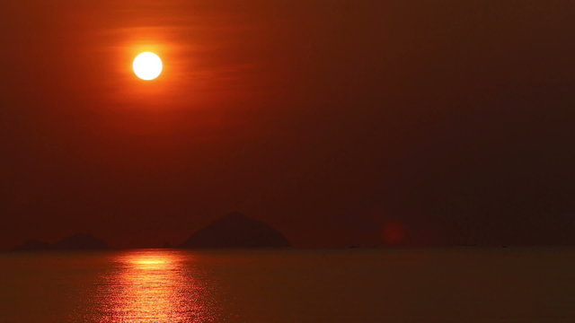 panorama of sunrise above sea at background of islands