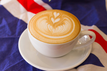 Coffee latte art on the wood desk