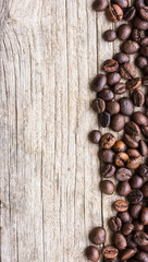 Coffee beans on wood background
