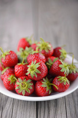 Strawberry on the old wood background. Healthy and tasty food
