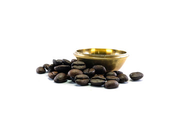 Coffee beans with brass bolw isolated on white background