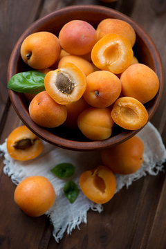 Close-up of ripe apricots in a ceramic bowl, high angle view