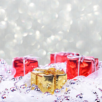 Christmas background with red and golden gifts