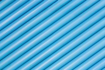 Obraz premium Blue pvc pipes in line for background texture