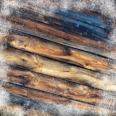 Old wooden background with snow flakes.Christmas background