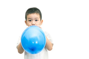 Fototapeta na wymiar Little asian boy blowing a blue balloon isolated on white backgr