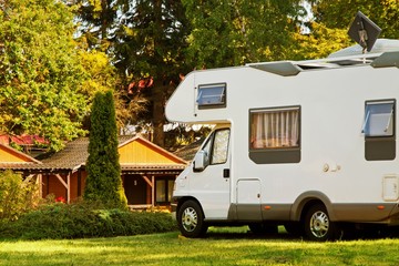 Caravan camper car on campsite - obrazy, fototapety, plakaty