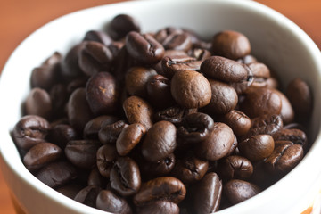 Coffee beans placed in a cup