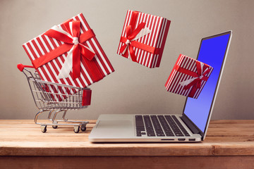 Shopping online concept with laptop computer and git box