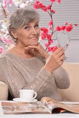 Elderly woman with mirror