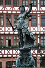 Fototapeta na wymiar justizia statue at the roemer in frankfurt germany