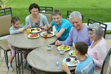 Family at breakfast on  resort