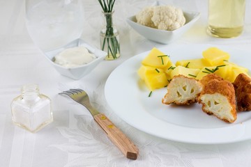 Fork in front of portion of breaded cauliflower
