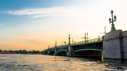 Fototapeta na wymiar Troitsky bridge during sunrise