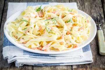 Homemade tagliatelle with salmon and dill