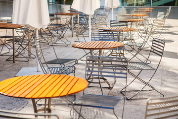 Outdoor restaurant open air cafe chairs with table