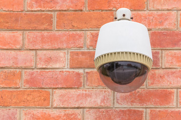 Security Camera CCTV On The Brick Wall.