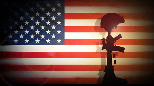 Silhouette Of The Cross Of The Fallen Soldier On A Background Of The US Flag.