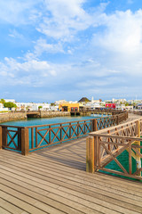 Wooden footbridge in marina Rubicon in Playa Blanca village, Lanzarote island, Spain