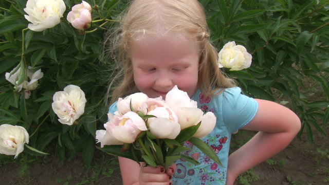 beautiful little girl with a bouquet of flowers