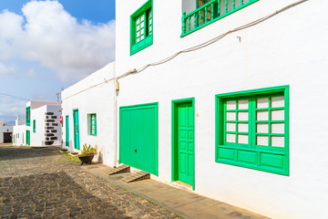 Typical white houses with green windows and doors in Teguise town, Lanzarote island, Canary Islands, Spain