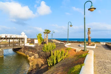 Fototapeten Coastal promenade along ocean in Costa Teguise seaside resort town, Lanzarote, Canary Islands, Spain © pkazmierczak