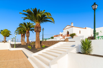 Fototapeta na wymiar White steps to typical Canarian church in Las Brenas village, Lanzarote, Canary Islands, Spain