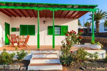 Typical white house with green door and windows in Las Brenas village, Lanzarote, Canary Islands, Spain