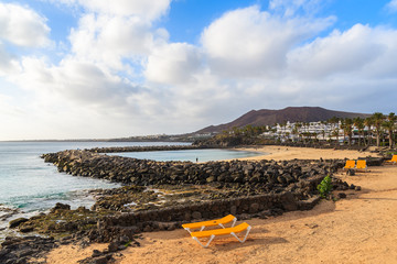 Sunbeds on Playa Blanca beach, Lanzarote, Canary Islands, Spain