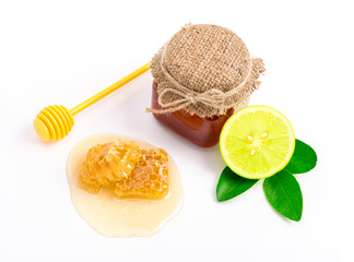 Fototapeta na wymiar honey and lemon on white - alternative medicine
