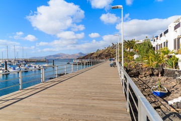 Obraz premium Promenade along ocean in Puerto del Carmen holiday resort town, Lanzarote, Canary Islands, Spain