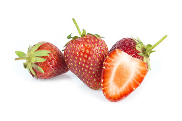 Stawberries and cutted isolated on white background