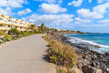 Coastal promenade along ocean in Playa Blanca holiday resort town, Lanzarote island, Spain