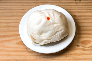 Steamed dumpling in white dish