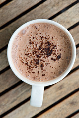 Hot chocolate in a white cup on table