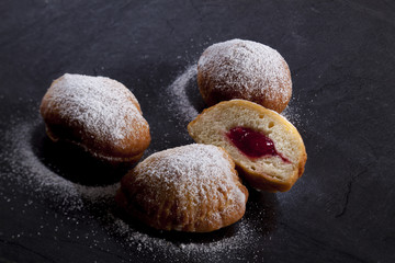 Fresh baked German Jelly Doughnut filled with jam and dusted with sugar icing